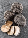 Black truffles and truffle slices. Royalty Free Stock Photo