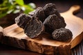 Black Truffles On Wooden Board