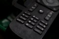 Black TV remote control made of frosted plastic Royalty Free Stock Photo