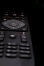 Black TV remote control made of frosted plastic Royalty Free Stock Photo