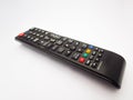 black TV Remote with various button on white isolated Background