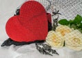 Black underwear knickers in gliter red box heart shaped perfume white roses juwelery on white background