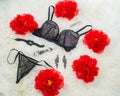 Black underwear knickers perfume roses juwelery on white background