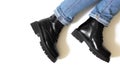 Black unisex boots isolated on white background for winter and autumn weather with round toe, block heel and embossed Royalty Free Stock Photo