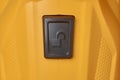 black unlock switch or button on yellow surface Royalty Free Stock Photo