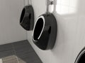 Black urinals in men public toilet. Modern ceramic urinals hanging on the tiled wall. 3d rendering illustration