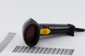 Black USB barcode scanner with yellow shutter