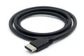 Black usb c cable curled on white surface ready for data transfer technology Royalty Free Stock Photo