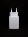 White USB charger head/adapter in black isolated background