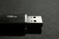 Black USB flash drive on black surface Royalty Free Stock Photo