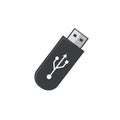 Black USB flash drive on a white background. The design features a standard USB Royalty Free Stock Photo