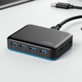Black USB hub with a sleek, rectangular design features multiple USB 3.0 ports on the Royalty Free Stock Photo