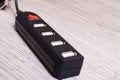 Black USB hub on a wooden background Royalty Free Stock Photo