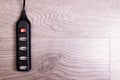 Black USB hub on a wooden background Royalty Free Stock Photo