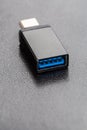 Black USB OTG USB on The Go for connection betwen cellphone and flash disk drive Royalty Free Stock Photo