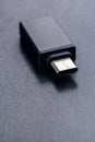 Black USB OTG USB on The Go with USB Type C port for connection betwen cellphone and flash disk drive Royalty Free Stock Photo