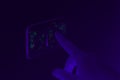 Black UV light exposing germs and bacteria on hand touching lighting switch - Ultraviolet blacklight shows hidden