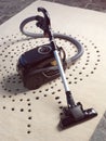 Black vacuum cleaner on carpet Royalty Free Stock Photo