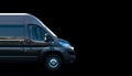 Black van on a dark background Royalty Free Stock Photo