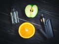 Black vaporizer in the smoke with sliced orange and apple Royalty Free Stock Photo