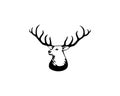 Black vector silhouette of deer`s head with antlers isolated on white background. Royalty Free Stock Photo