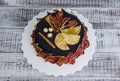 Black velour cake with cured pears, oranges, nuts and cinnamon Royalty Free Stock Photo