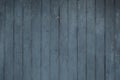 Black vertical faded worn weathered vertical wooden boards