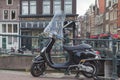 The Black Vespa Scooter is parking in the Amsterdam