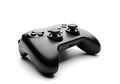 A black video game controller with joysticks and buttons isolated on white background Royalty Free Stock Photo