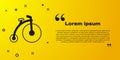 Black Vintage bicycle with one big wheel and one small icon isolated on yellow background. Bike public transportation Royalty Free Stock Photo