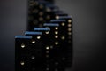 Black vintage dominoes on a black background, selective focus Royalty Free Stock Photo