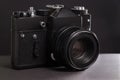 Black vintage film camera on dark background withot brand