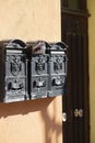 Black vintage mailboxes at house Castelsardo Sardinia.