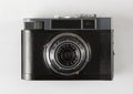 Vintage retro photo camera isolated on the white background close-up front view