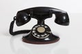 Black, vintage rotary phone on white Royalty Free Stock Photo