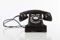 Black, vintage rotary phone on white Royalty Free Stock Photo