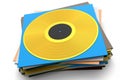 Black vinyl LP record with heap of covers isolated on white background. Royalty Free Stock Photo