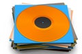 Black vinyl LP record with heap of covers isolated on white background. Royalty Free Stock Photo