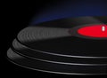 A black vinyl 33 1/3 rpm record album with a red label is seen Royalty Free Stock Photo