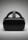 Black virtual reality headset displayed against a neutral gray Royalty Free Stock Photo