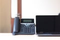 Black voip telephone on desk