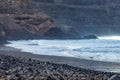 Black volcanic beach and ocean landscape Royalty Free Stock Photo