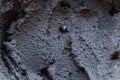 Black volcanic cosmetic clay in a bowl. cosmetic clay texture close up. solution of cosmetic clay abstract background Royalty Free Stock Photo