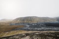 Black volcanic lava rocks in the valley still cooling down near Geldingadalir volcano