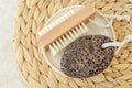 Black volcanic pumice stone and massage foot brush with natural bristles. Eco friendly toiletries. Homemade pedicure Royalty Free Stock Photo