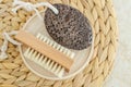 Black volcanic pumice stone and massage foot brush with natural bristles. Homemade pedicure concept Royalty Free Stock Photo