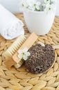 Black volcanic pumice stone and massage foot brush with natural bristles. Homemade spa, pedicure concept Royalty Free Stock Photo