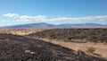 Black volcanic rock in the Mojave desert landscape in California USA