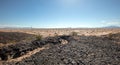 Black volcanic rock in the Mojave desert landscape in California USA