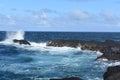Black volcanic rocks with wave splash along the coastline of the Hawaiian Island of Maui, Hawaii Royalty Free Stock Photo